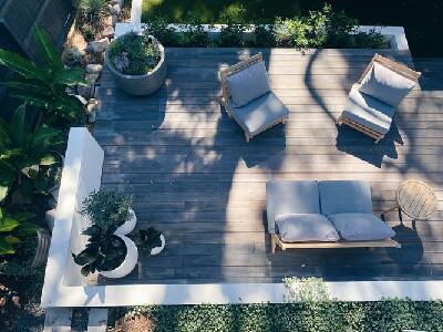 Backyard furniture on an improved wooden deck